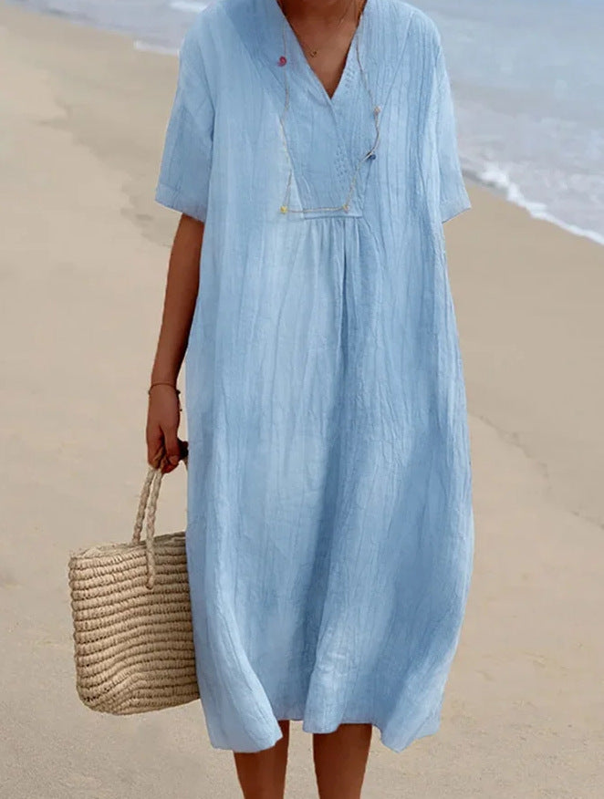 Vibrant green women's casual relaxed fit V-neck short sleeve dress. Ideal for summer beach or resort.