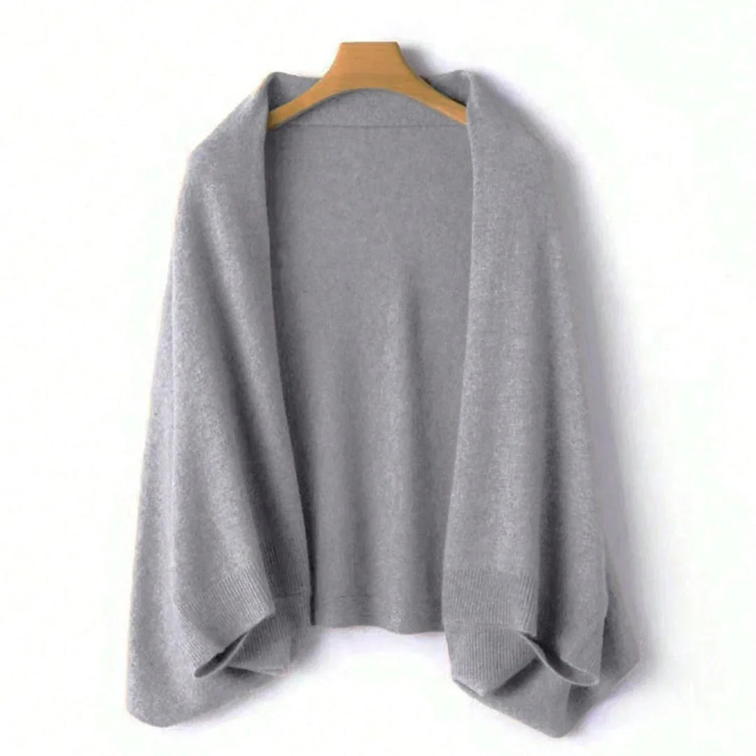 Premium pure wool women's wrap, providing luxurious comfort & a cashmere-like feel. Ideal for cozy winter fashion.