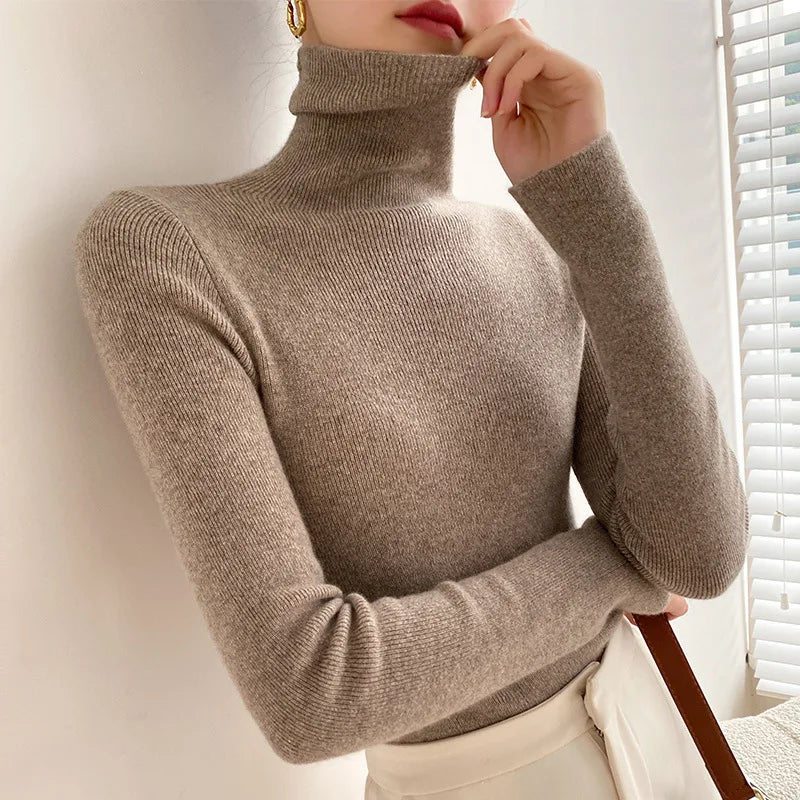 Women's luxurious winter cashmere turtleneck sweater, warm soft knit for elegant style and layering.