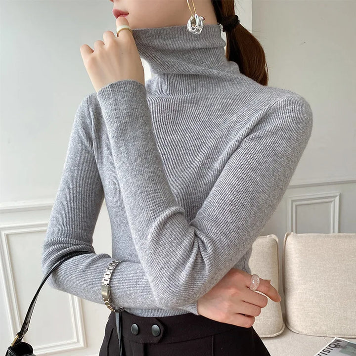 Premium women's cashmere turtleneck sweater, a luxurious soft knit for sophisticated winter elegance.
