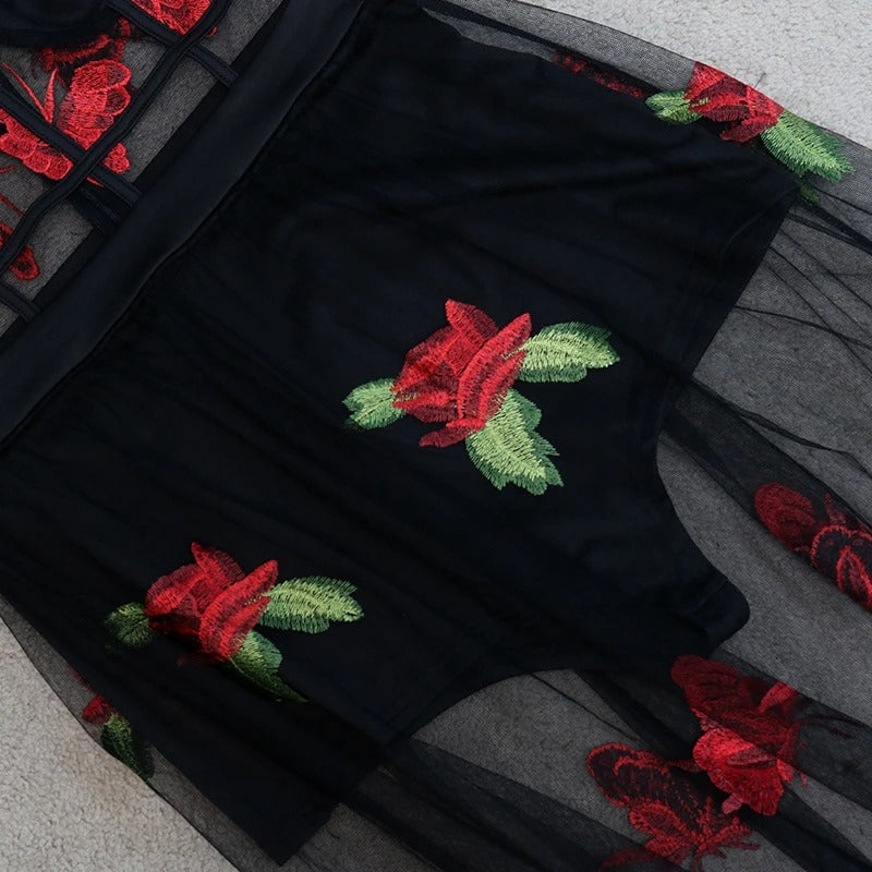 Flowy sleeveless maxi dress with intricate floral embroidery and spaghetti straps, a chic summer vacation dress.
