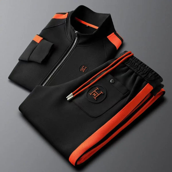Stylish men's two-piece tracksuit. Features a functional zip-up jacket and relaxed straight-leg pants for comfort.