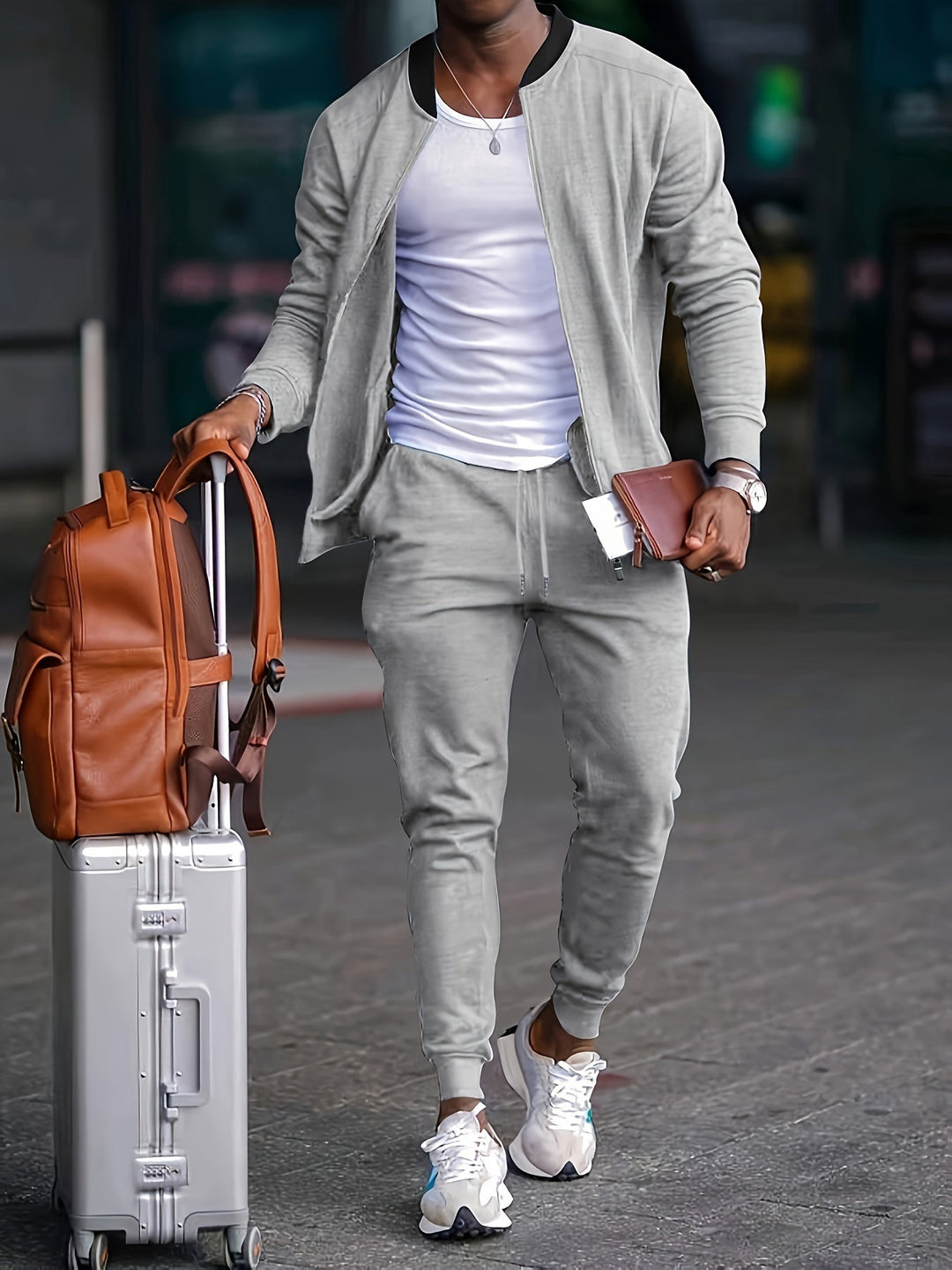 Stylish black men's tracksuit, perfect for sportswear or an athletic casual outfit with zipper closure