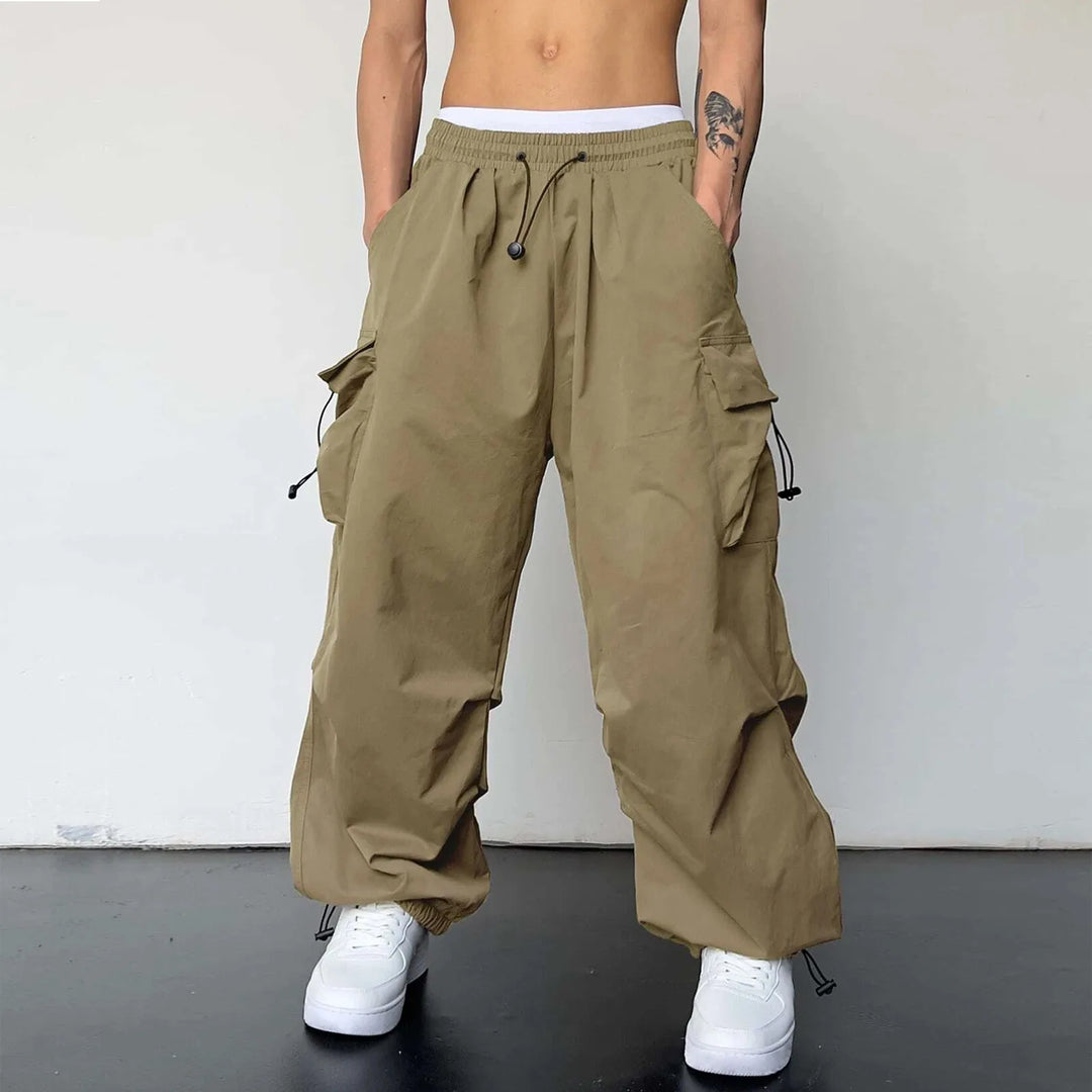 Comfortable men's baggy cargo parachute pants, loose fit, drawstring waist. Ideal casual utility pants for urban style.