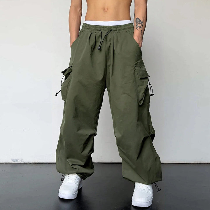 Stylish men's parachute pants, baggy cargo design, loose fit, suitable for Y2K fashion & streetwear trends.