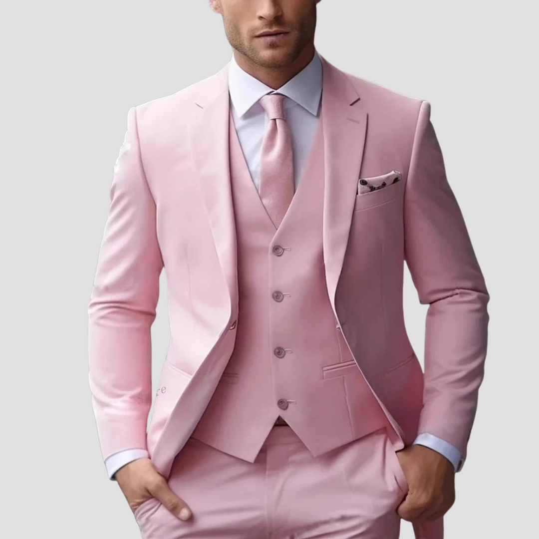 Man in a chic black slim fit three-piece suit, showcasing classic menswear and a modern aesthetic.