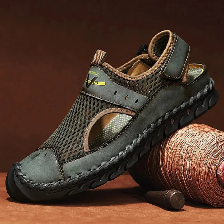 Sporty men's sandals, black and grey, offering breathability for outdoor adventures and casual use