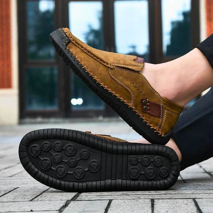 Men's brown slip-on shoes with strong arch support for all-day comfort, ideal for walking & casual wear.