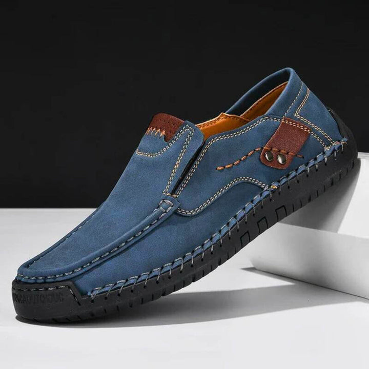 Orthopedic men's blue slip-on shoes, designed for all-day foot relief, featuring excellent arch support & comfort.