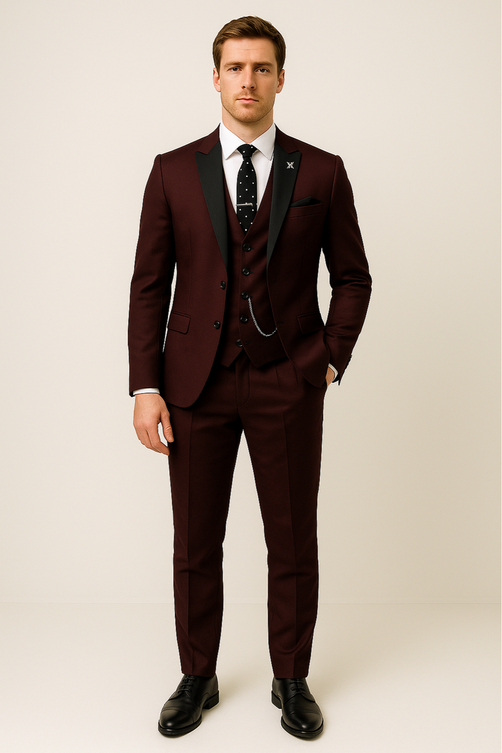 Close-up of a men's formal burgundy three-piece suit, showcasing fabric detail and tailoring.