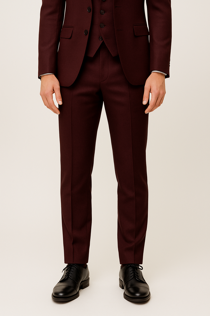 Full shot of a men's apparel burgundy suit, complete with trousers, vest, and jacket; formal wear.