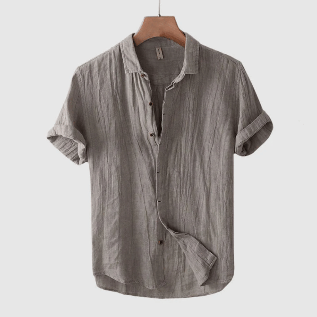 Lightweight men's short sleeve button-down summer shirt, perfect for beach trips or casual outings.