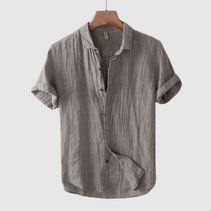 Lightweight men's short sleeve button-down summer shirt, perfect for beach trips or casual outings.