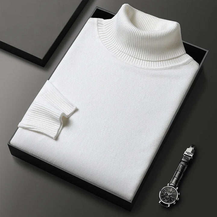 Close-up of soft cashmere blend fabric on a men's turtleneck sweater, highlighting the quality knitwear.