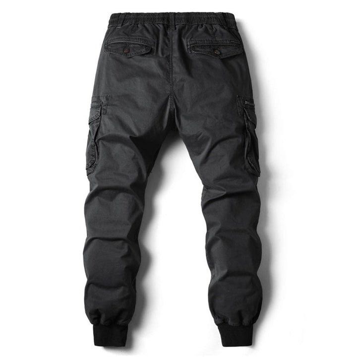 Men's casual black jogger pants with an elastic waist, showing the comfortable fit.