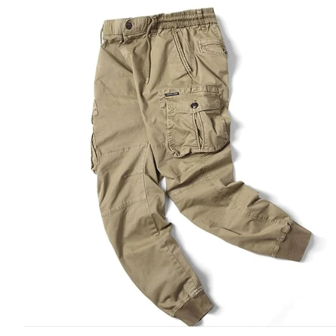 Streetwear-inspired men's jogger pants in gray with an elastic waistband and cuffs.