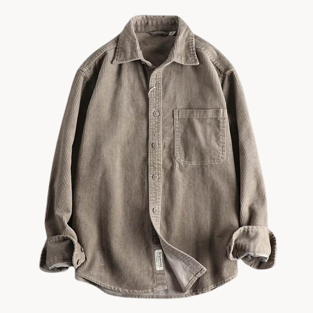 Close-up of the sleeve cuff on a men's textured corduroy long sleeve button-down shirt.