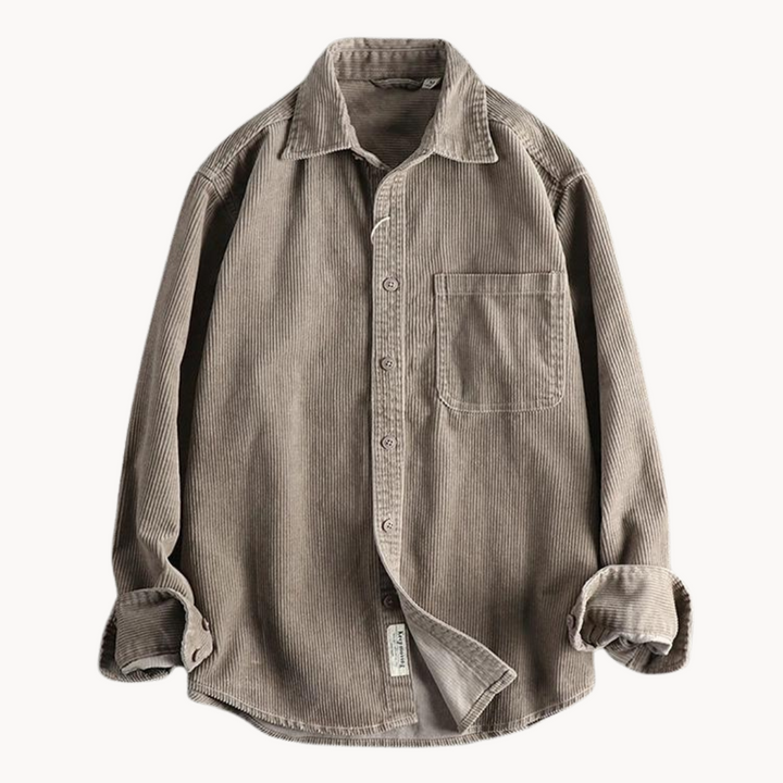 Close-up of the sleeve cuff on a men's textured corduroy long sleeve button-down shirt.