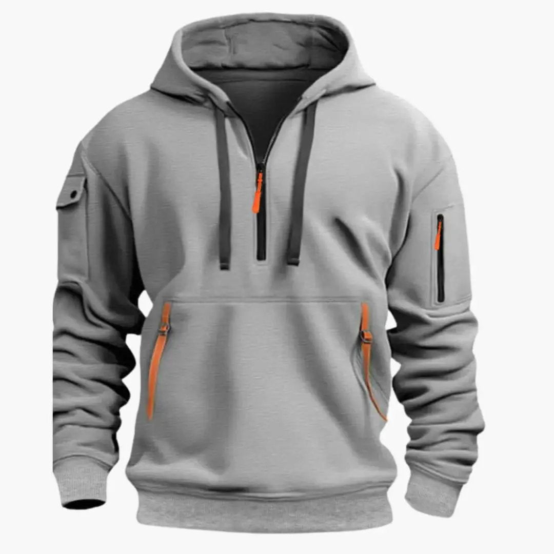 Men's activewear half-zip pullover hoodie with secure zippered pockets, perfect for streetwear fashion.