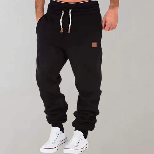 Comfortable men's lounge wear jogging pants with elastic waist and drawstring, designed for ultimate relaxation.