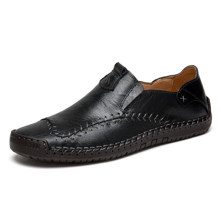 Close-up of hand stitching on men's casual leather shoes, emphasizing the soft sole comfort