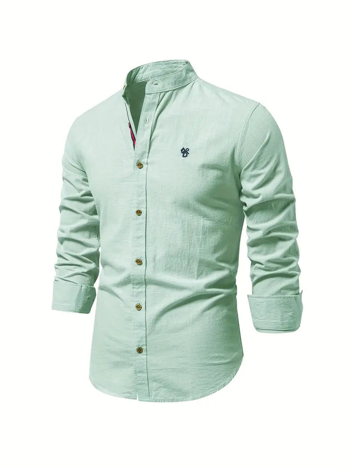 Close-up of a men's casual button-down shirt, showing fabric texture and buttons, relaxed fit.