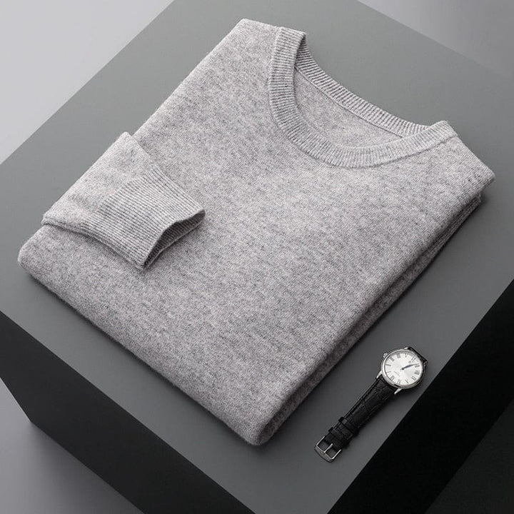 Close-up of the texture of a men's knit sweater, showing crewneck detail, comfortable fabric