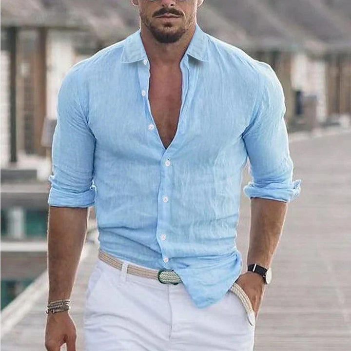 Detail shot of a men's casual long sleeve button-up shirt's turn-down collar. Regular fit, lightweight fabric.