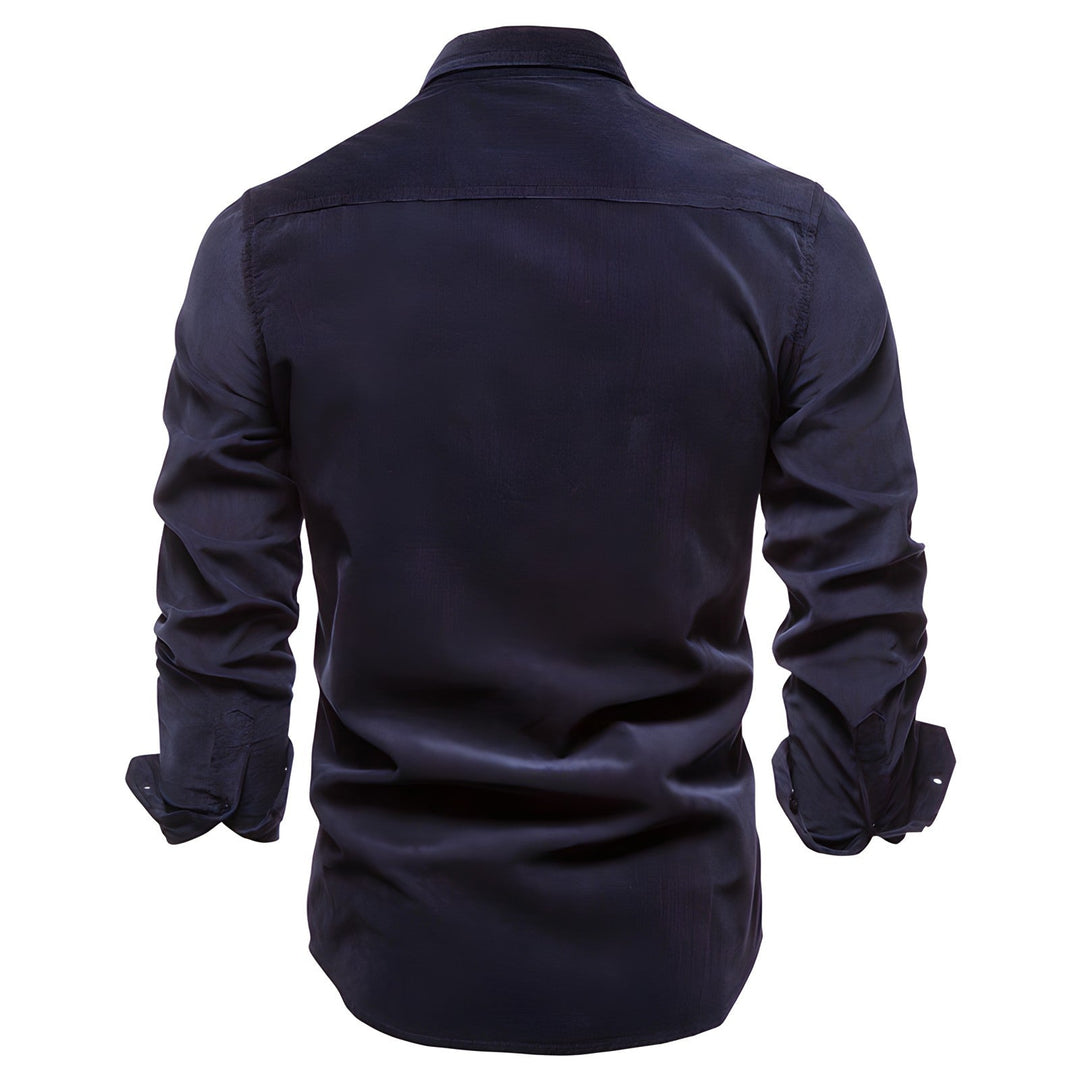 Close-up of men's utility shirt pocket with button closure, durable fabric, casual menswear