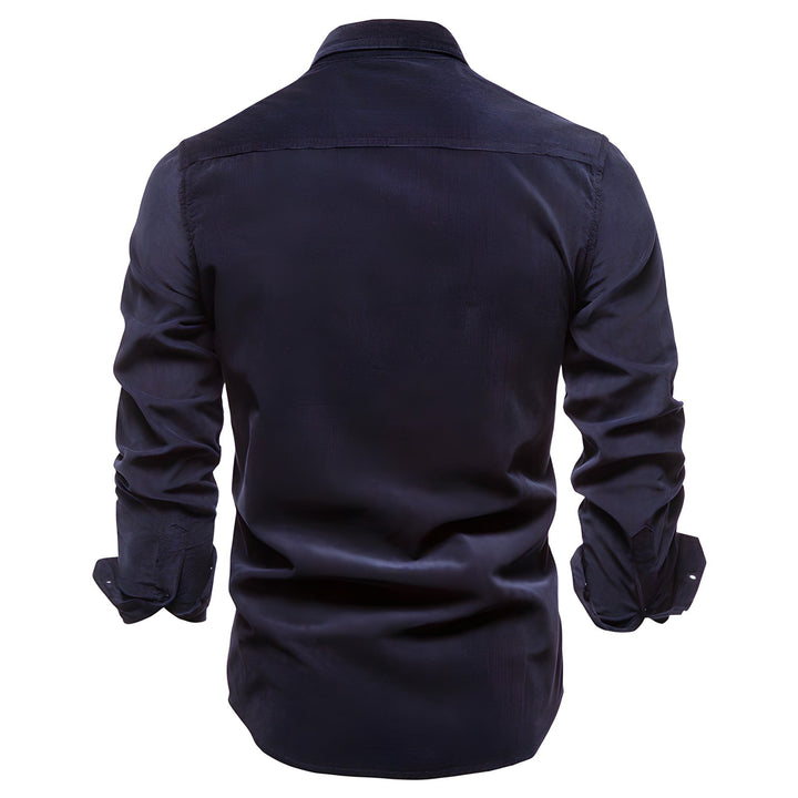 Close-up of men's utility shirt pocket with button closure, durable fabric, casual menswear
