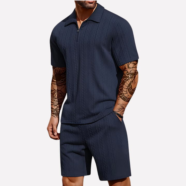 Breathable men's summer outfit: a casual quarter-zip polo shirt paired with comfortable shorts.