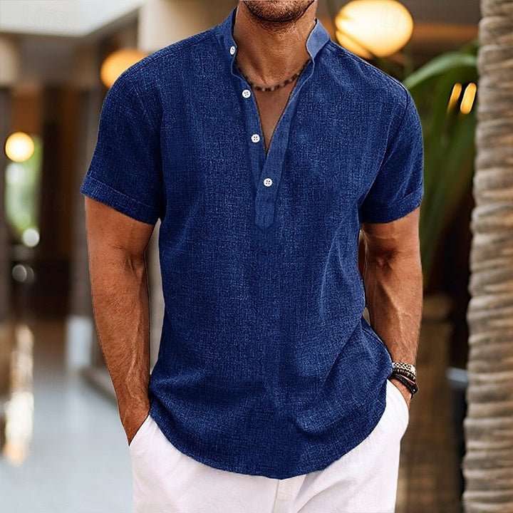 Relaxed fit men's short sleeve Henley, versatile for casual summer fashion. Features a stylish button placket.