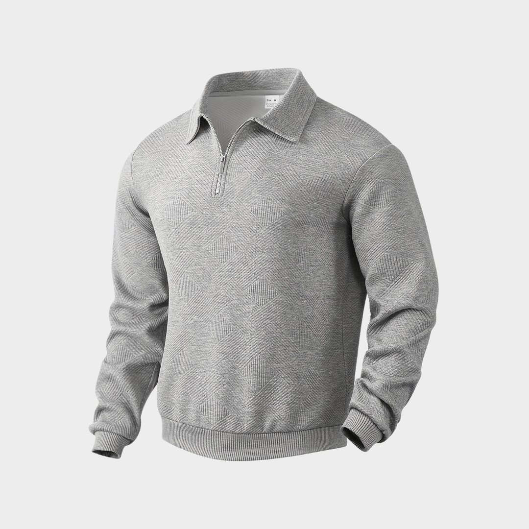Lifestyle shot of a man in a textured half zip pullover sweater, enjoying a casual outdoor setting