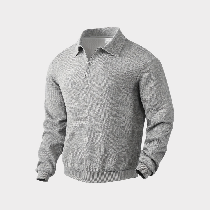 Lifestyle shot of a man in a textured half zip pullover sweater, enjoying a casual outdoor setting