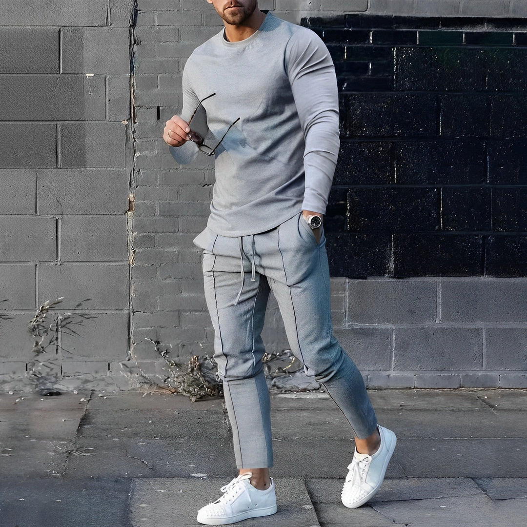 Stylish men's long sleeve top & jogger pants set, perfect for casual wear and streetwear fashion