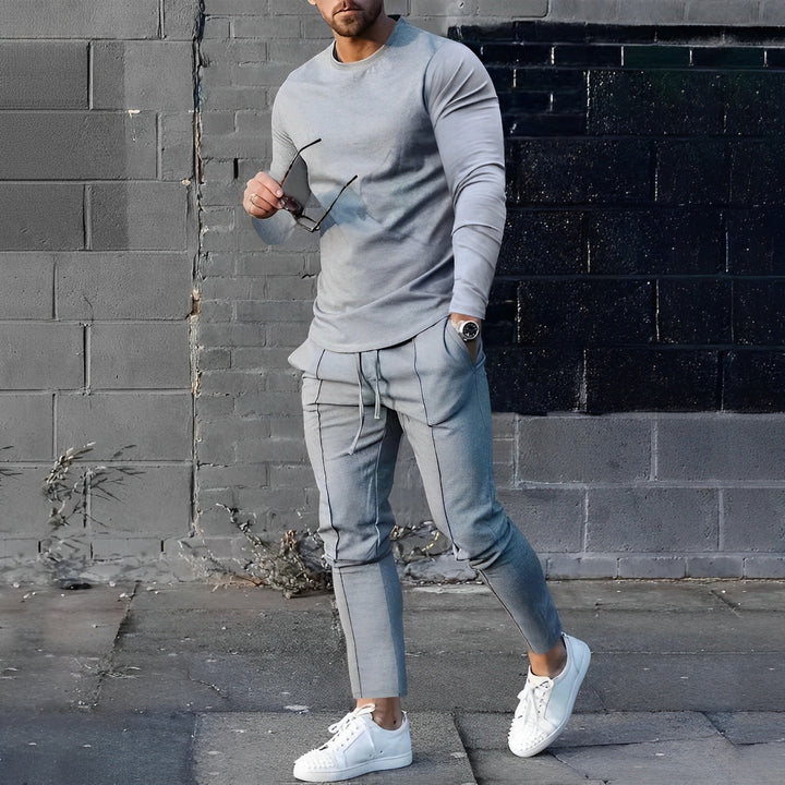 Stylish men's long sleeve top & jogger pants set, perfect for casual wear and streetwear fashion