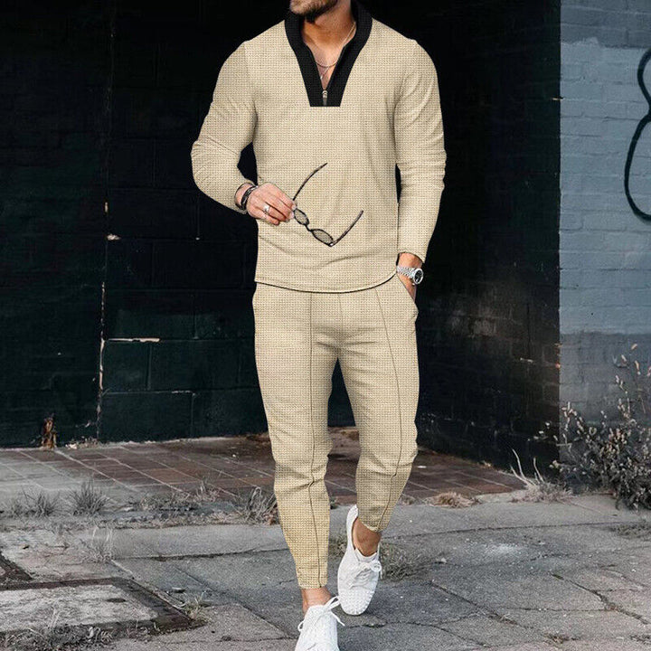 Men's casual two-piece tracksuit in navy, featuring a zip-up top and matching comfortable trousers.