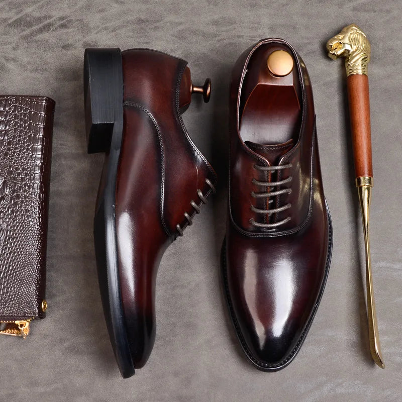 High-quality classic men's Oxfords in polished black leather, versatile for formal, business, and elegant events.