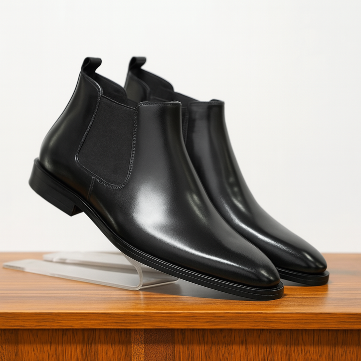 Stylish men's brown leather Chelsea boots with a sleek design, suitable for various occasions and outfits.