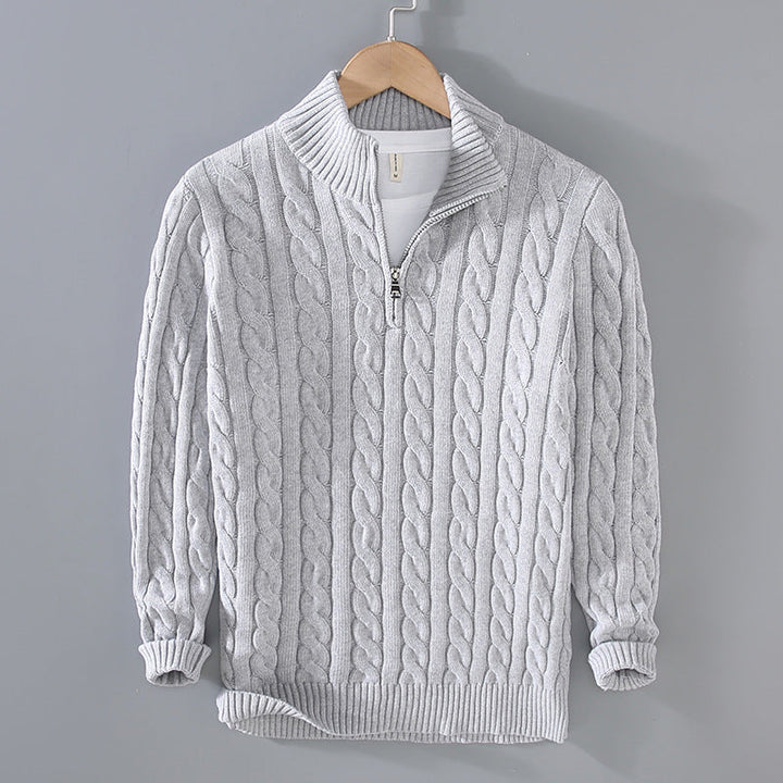 Model wearing a stylish men's half-zip cable knit pullover, perfect for winter fashion