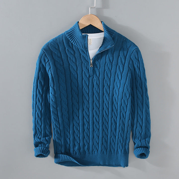 Front view of a rugged yet refined men's half-zip cable knit pullover in knitwear collection