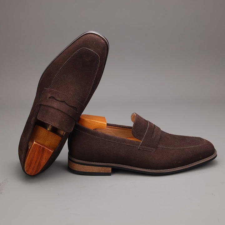 Men's classic slip-on loafers in brown, offering comfort & style for everyday and office wear.