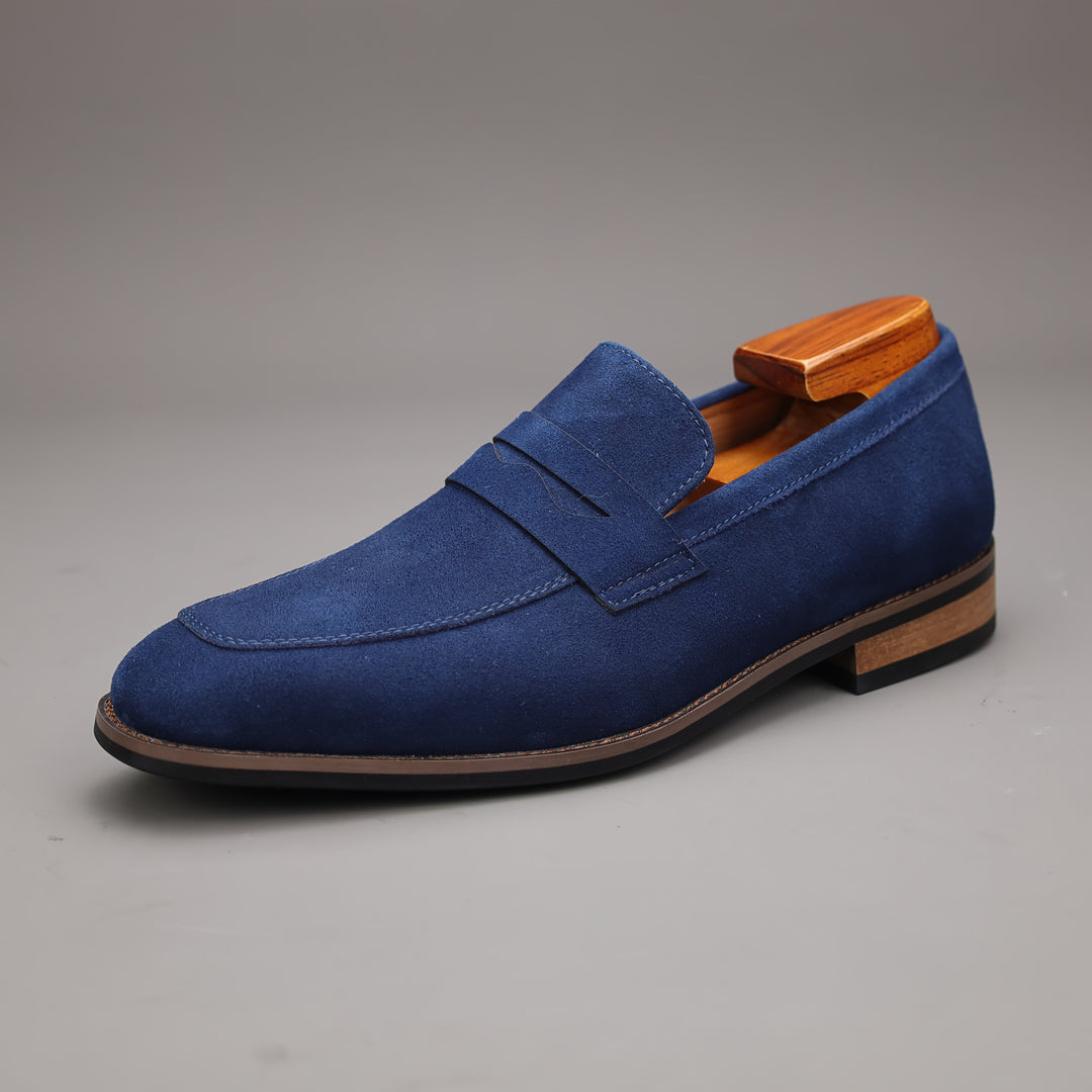 Side profile of men's classic penny loafers, a versatile slip-on shoe suitable for casual or formal outfits.