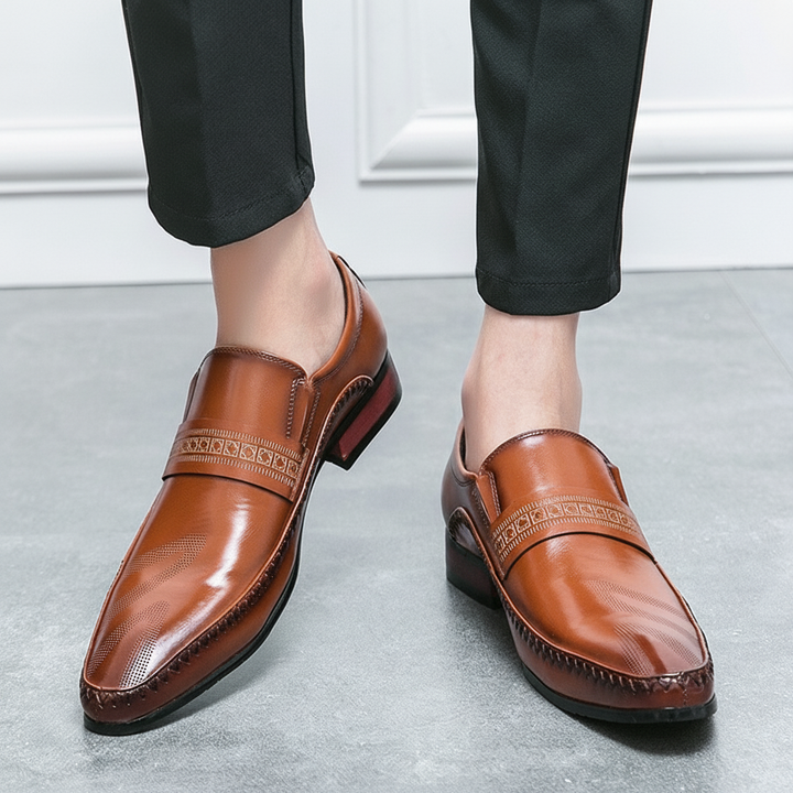 Men's classic slip-on penny loafers in polished leather, perfect for versatile dress or casual style.