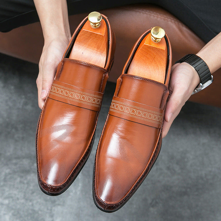 Close-up of a men's classic brown penny loafer, highlighting the polished finish and slip-on convenience.