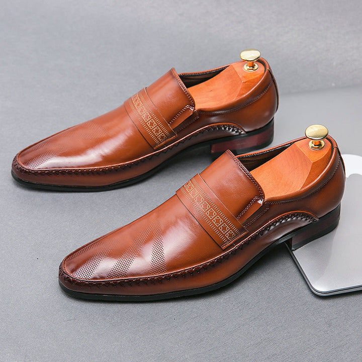 Stylish men's formal black slip-on loafers, essential for a sleek, polished look and easy wearability.