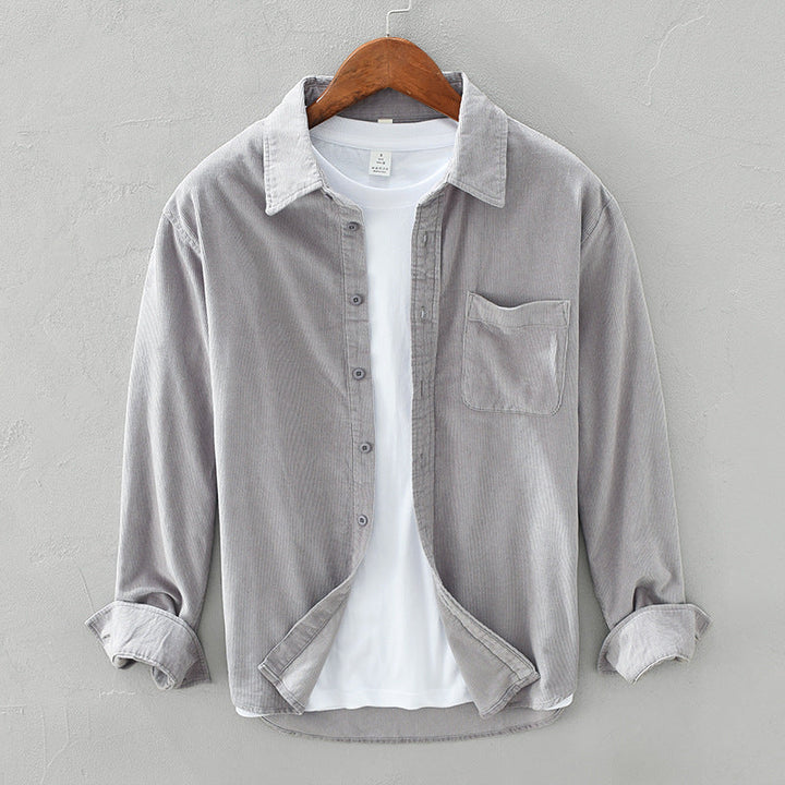 Stylish men's casual button-up shirt with chest pocket, a versatile textured top for everyday wear.