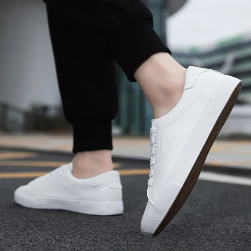 Modern grey men's low-top lace-up sneakers, offering comfort and athletic style for versatile everyday fashion.