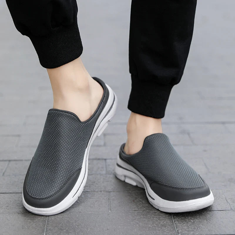 Comfortable men's closed-toe mule sandals with slip-on design, ideal for summer and everyday casual wear.