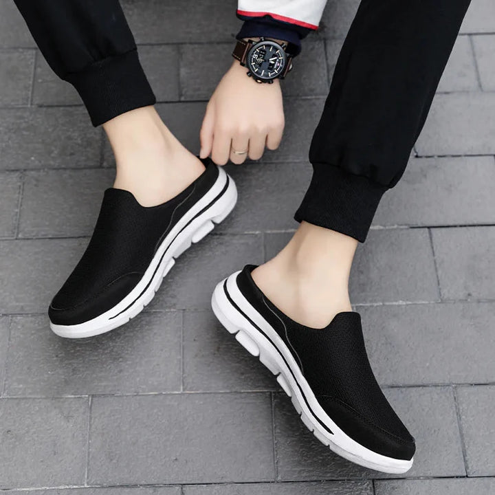 Textured men's closed-toe slip-on mule sandals featuring a durable sole for lasting comfort.